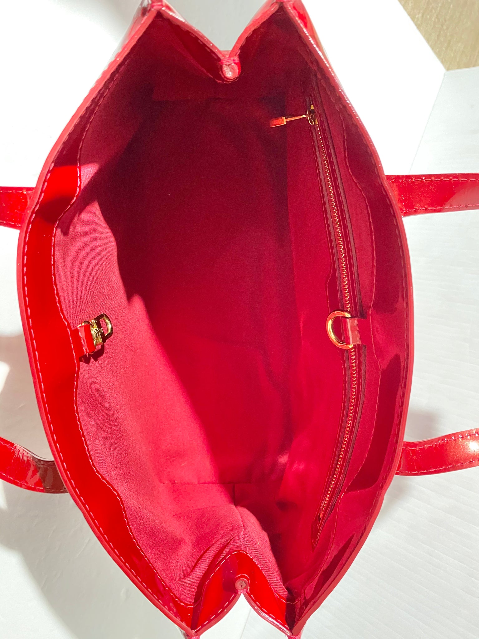 Lot 681 - A Louis Vuitton Red vernis leather Wilshire